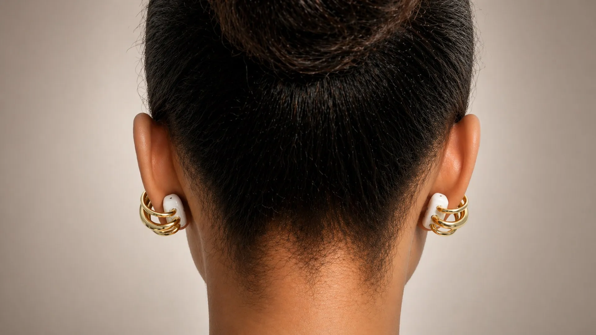 Rear view showing Elara worn on both ears